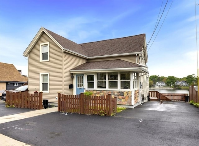 121 Lynnfield St, Lynn, MA 01904 - view of front of property with roof with shingles, a water view, and stone siding