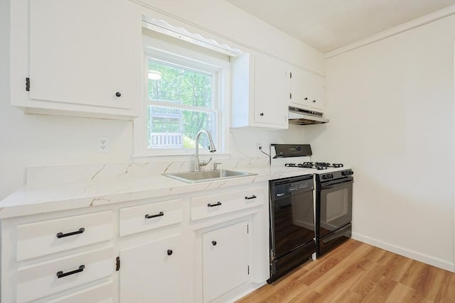 13 Dixon Cir, Holliston, MA 01746 - kitchen with black appliances, under cabinet range hood, a sink, white cabinetry, and light wood-style flooring
