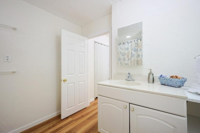 13 Dixon Cir, Holliston, MA 01746 - bathroom featuring vanity, wood finished floors, and baseboards