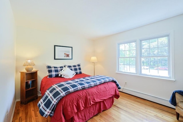 13 Dixon Cir, Holliston, MA 01746 - bedroom with baseboard heating, wood finished floors, and baseboards