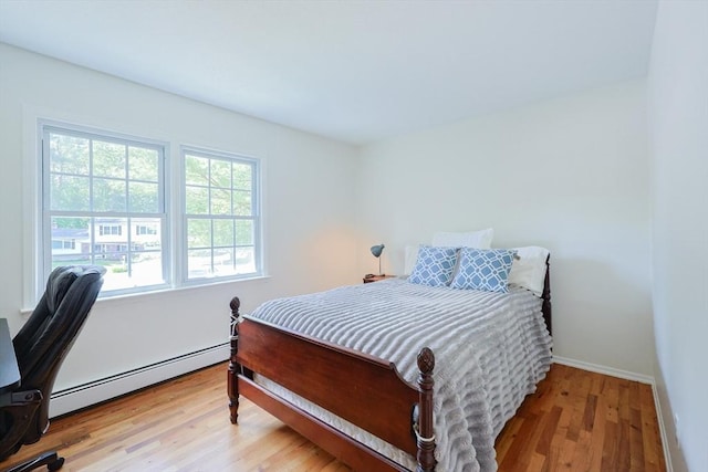 13 Dixon Cir, Holliston, MA 01746 - bedroom featuring a baseboard radiator, wood finished floors, and baseboards