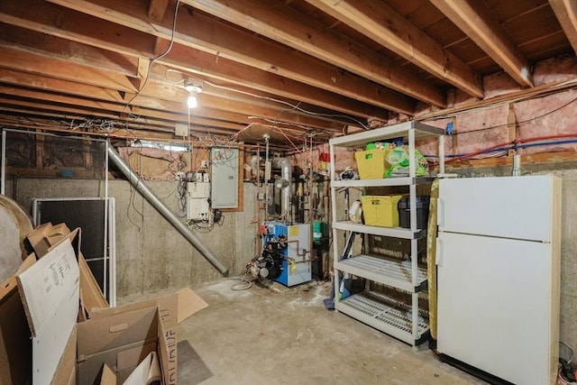 13 Dixon Cir, Holliston, MA 01746 - unfinished below grade area featuring freestanding refrigerator, a heating unit, and electric panel