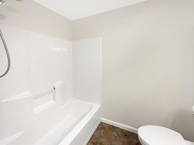 full bathroom with baseboards and toilet