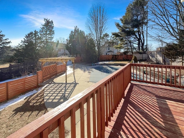 deck featuring a patio area and a fenced backyard