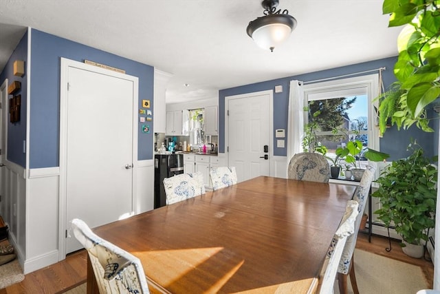 dining area with light hardwood / wood-style floors