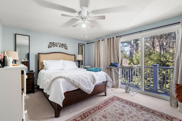 bedroom featuring light carpet, access to exterior, and ceiling fan