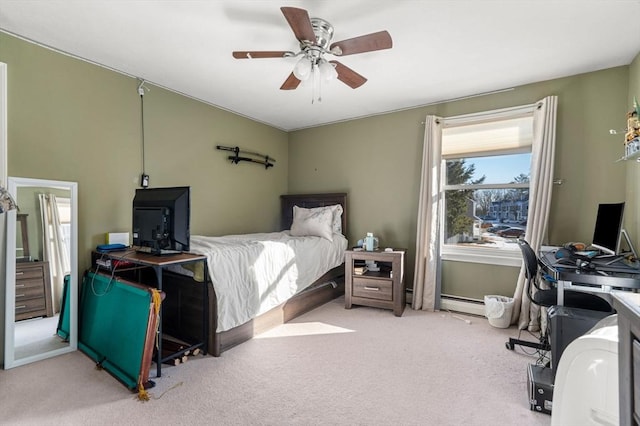 carpeted bedroom featuring ceiling fan and baseboard heating