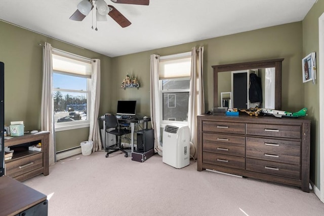 carpeted office with ceiling fan and baseboard heating