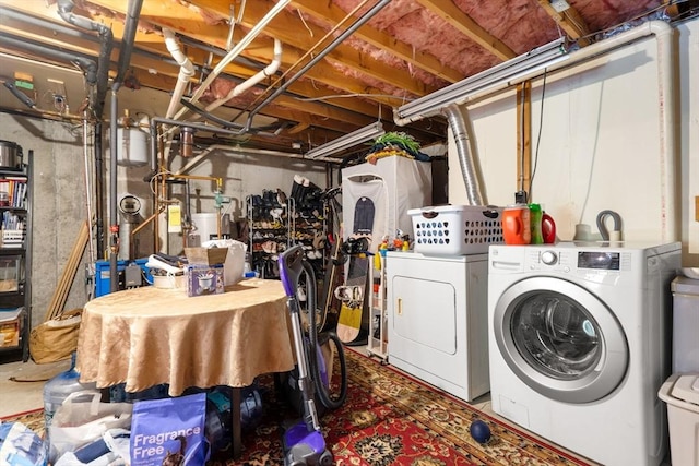 clothes washing area with washing machine and clothes dryer