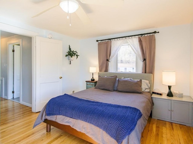 bedroom featuring light wood finished floors and ceiling fan