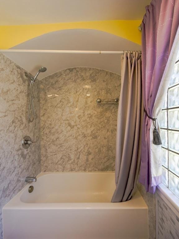 bathroom featuring shower / bathtub combination with curtain