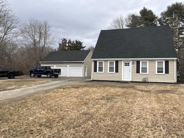 new england style home with a shingled roof