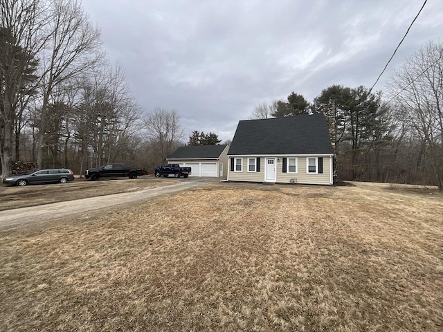 view of front of property with a garage and a front yard