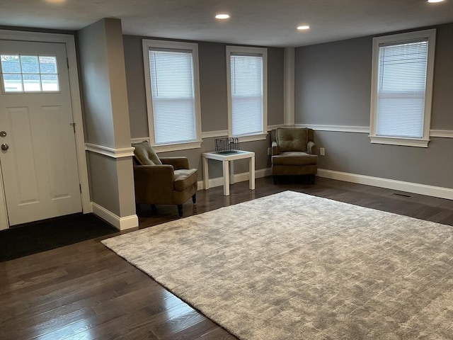 entrance foyer featuring recessed lighting, visible vents, baseboards, and dark wood-type flooring