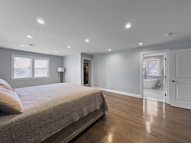 851 Forest St, North Andover, MA 01845 - bedroom featuring recessed lighting, wood finished floors, multiple windows, baseboards, and a walk in closet