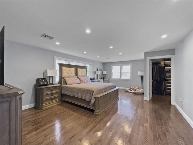 851 Forest St, North Andover, MA 01845 - bedroom with dark wood finished floors, a spacious closet, baseboards, and recessed lighting