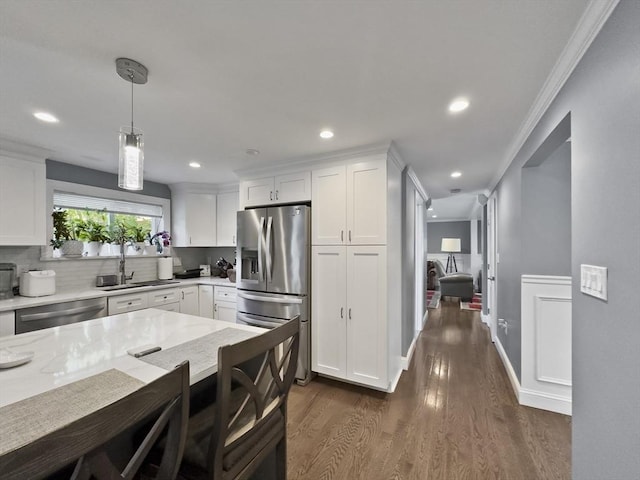 851 Forest St, North Andover, MA 01845 - kitchen featuring appliances with stainless steel finishes, dark wood-type flooring, white cabinets, light stone countertops, and recessed lighting