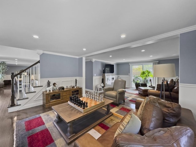 851 Forest St, North Andover, MA 01845 - living room with wood finished floors, a wainscoted wall, ornamental molding, recessed lighting, and stairway