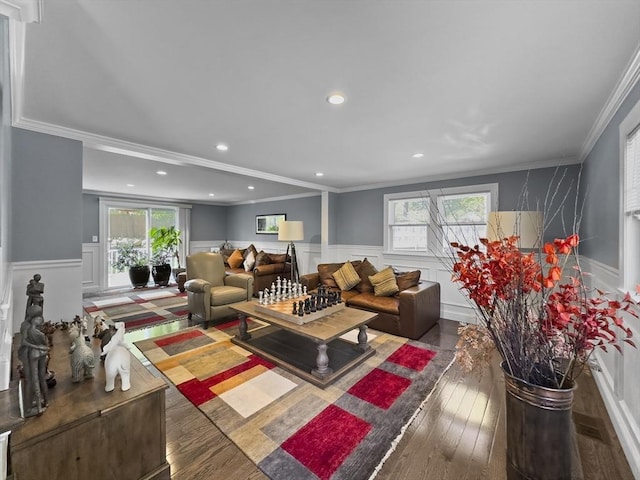 851 Forest St, North Andover, MA 01845 - living area with a wainscoted wall, plenty of natural light, ornamental molding, wood finished floors, and a decorative wall