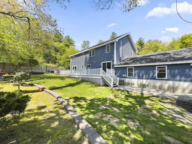 851 Forest St, North Andover, MA 01845 - back of property with a wooden deck, a patio, and central air condition unit