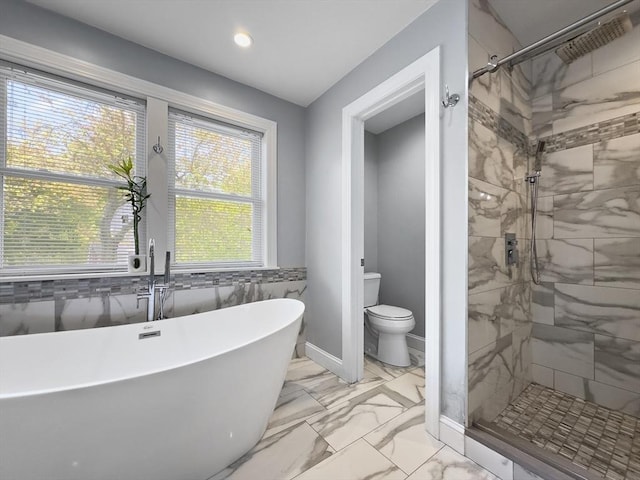 851 Forest St, North Andover, MA 01845 - bathroom with a freestanding tub, marble look tiles, a stall shower, toilet, and recessed lighting