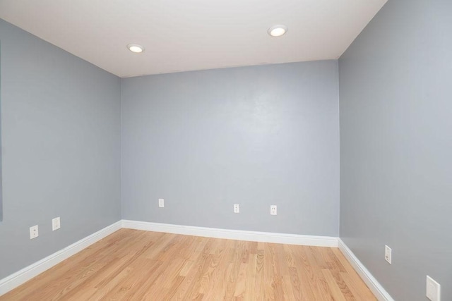 spare room with light wood-type flooring