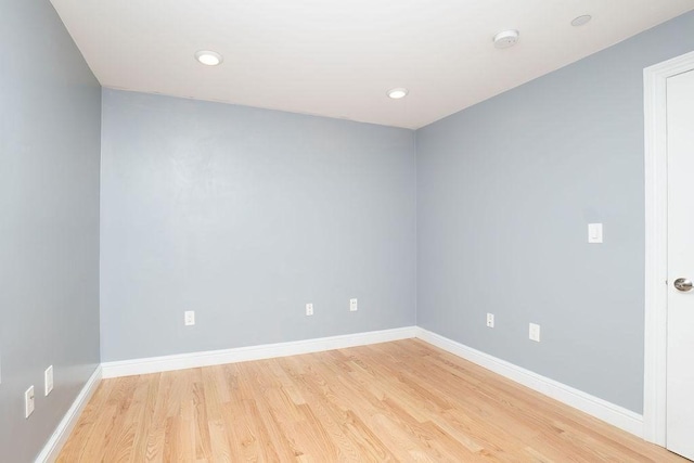 spare room featuring light hardwood / wood-style flooring