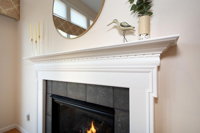 interior details with a tiled fireplace