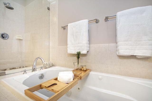 bathroom featuring tiled tub