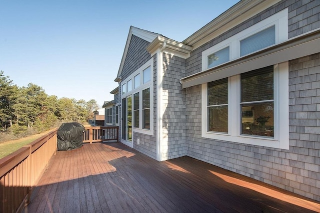 wooden terrace with area for grilling