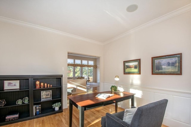 office featuring crown molding and light hardwood / wood-style floors