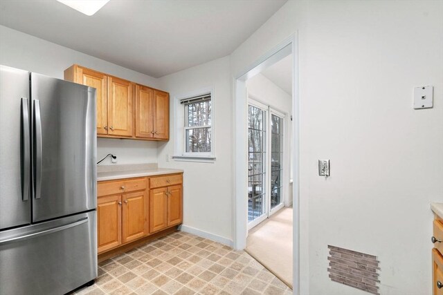 kitchen featuring stainless steel refrigerator