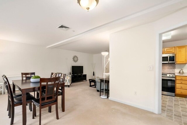 view of carpeted dining room