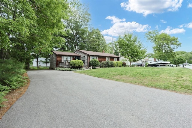 18 Phyllis Rd, Taunton, MA 02780 - ranch-style home with asphalt driveway, a front lawn, and a chimney