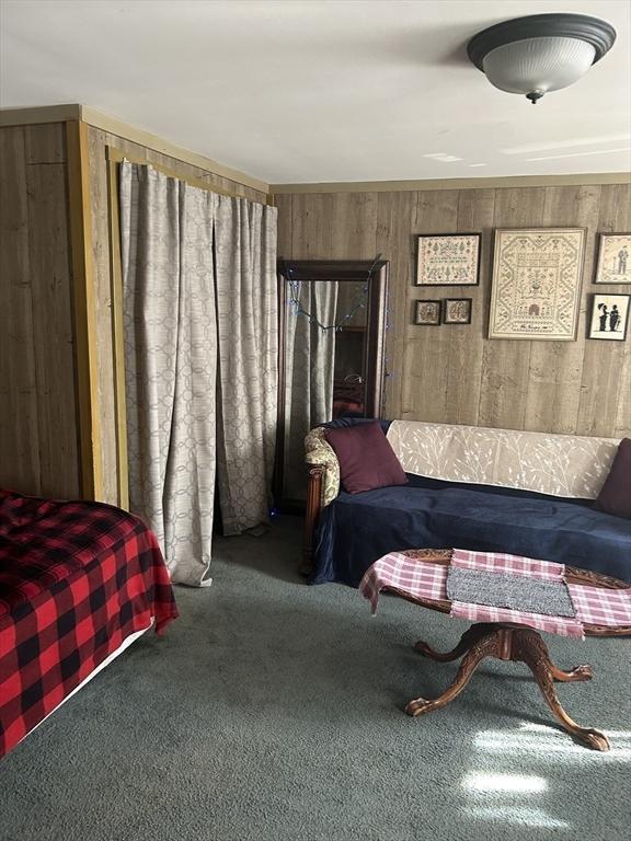 121 Kellogg St, Fall River, MA 02721 - carpeted bedroom featuring wooden walls