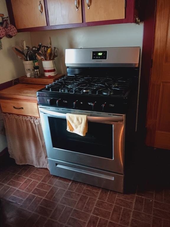 121 Kellogg St, Fall River, MA 02721 - kitchen with stainless steel range with gas cooktop and brick patterned flooring