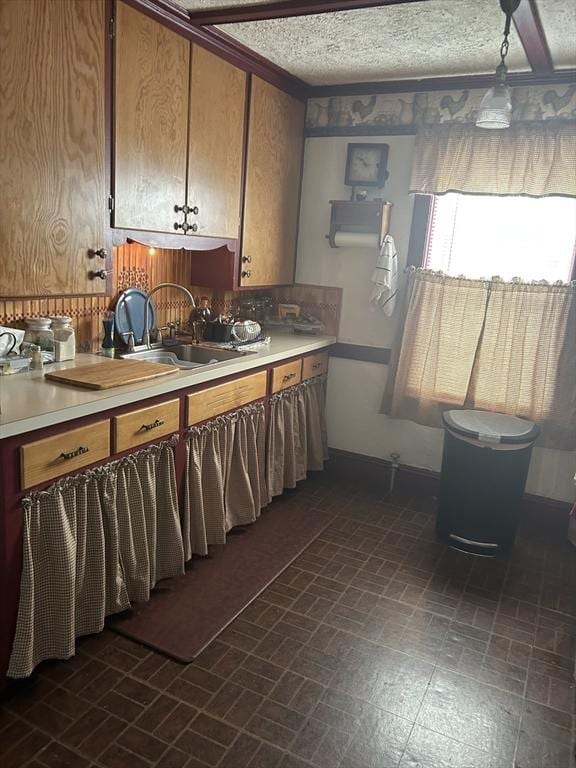 121 Kellogg St, Fall River, MA 02721 - kitchen with light countertops, brick patterned floors, and brown cabinetry