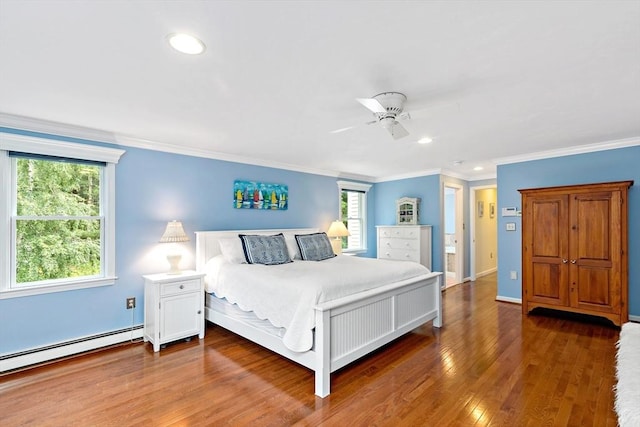 7 Lauras Ln, Marshfield, MA 02050 - bedroom with crown molding, multiple windows, wood finished floors, recessed lighting, and a baseboard radiator