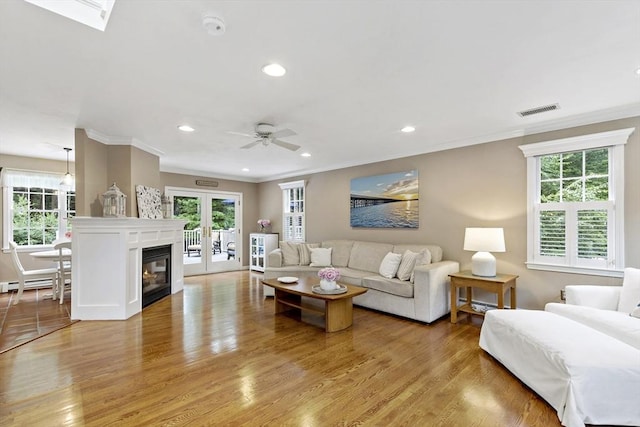 7 Lauras Ln, Marshfield, MA 02050 - living area with ornamental molding, plenty of natural light, light wood finished floors, recessed lighting, and ceiling fan