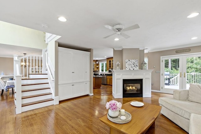 7 Lauras Ln, Marshfield, MA 02050 - living room featuring crown molding, ceiling fan, stairway, recessed lighting, and light wood-type flooring