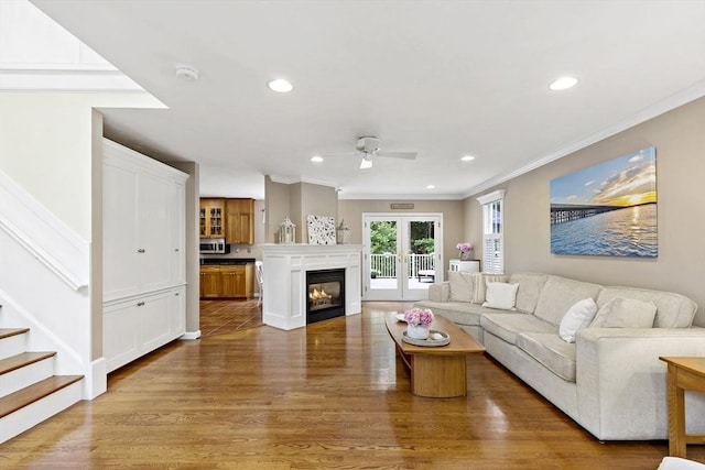 7 Lauras Ln, Marshfield, MA 02050 - living room with ornamental molding, ceiling fan, wood finished floors, recessed lighting, and french doors