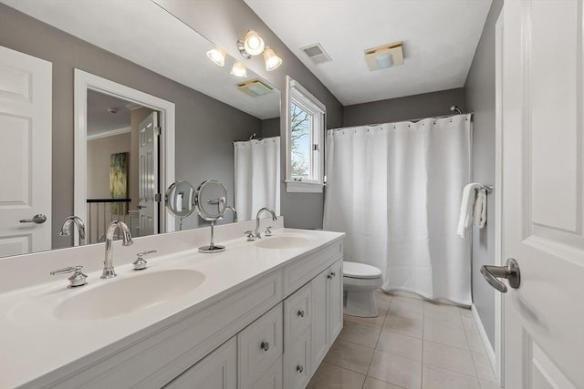 bathroom with a sink, tile patterned floors, and visible vents