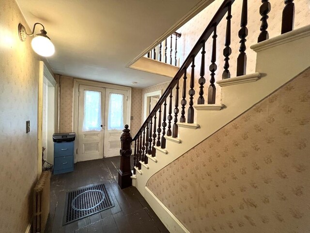 hall featuring dark hardwood / wood-style floors and radiator heating unit