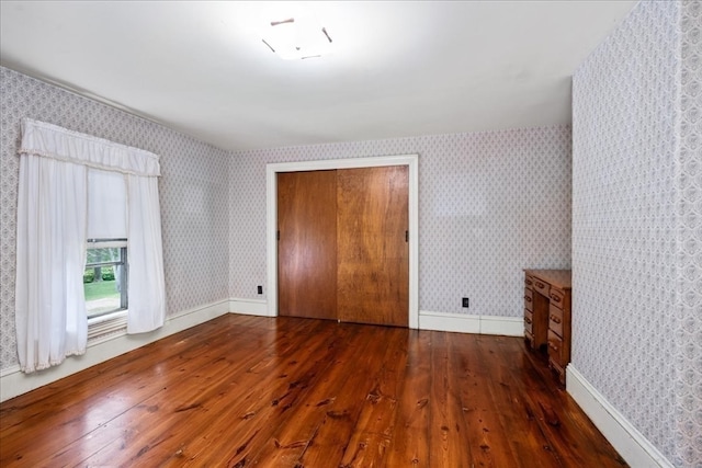 empty room featuring dark hardwood / wood-style floors