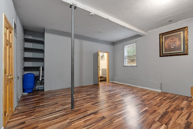 unfurnished bedroom featuring dark hardwood / wood-style floors