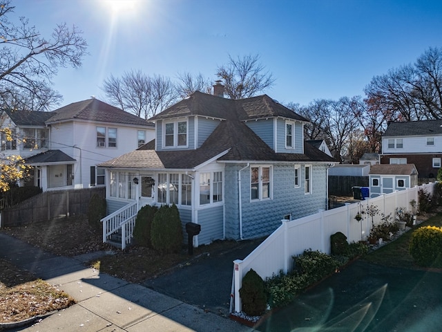 view of front of house featuring a sunroom