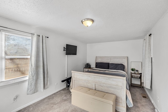 carpeted bedroom with a textured ceiling