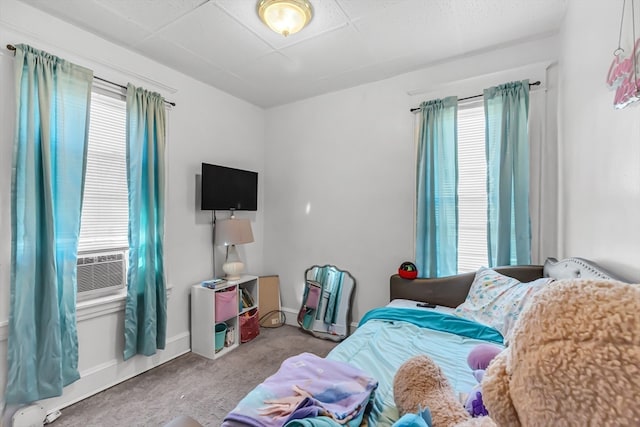 bedroom featuring light colored carpet