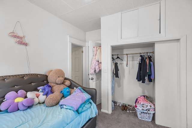 bedroom featuring a closet and light colored carpet