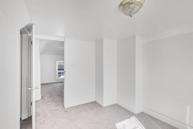 empty room with light colored carpet